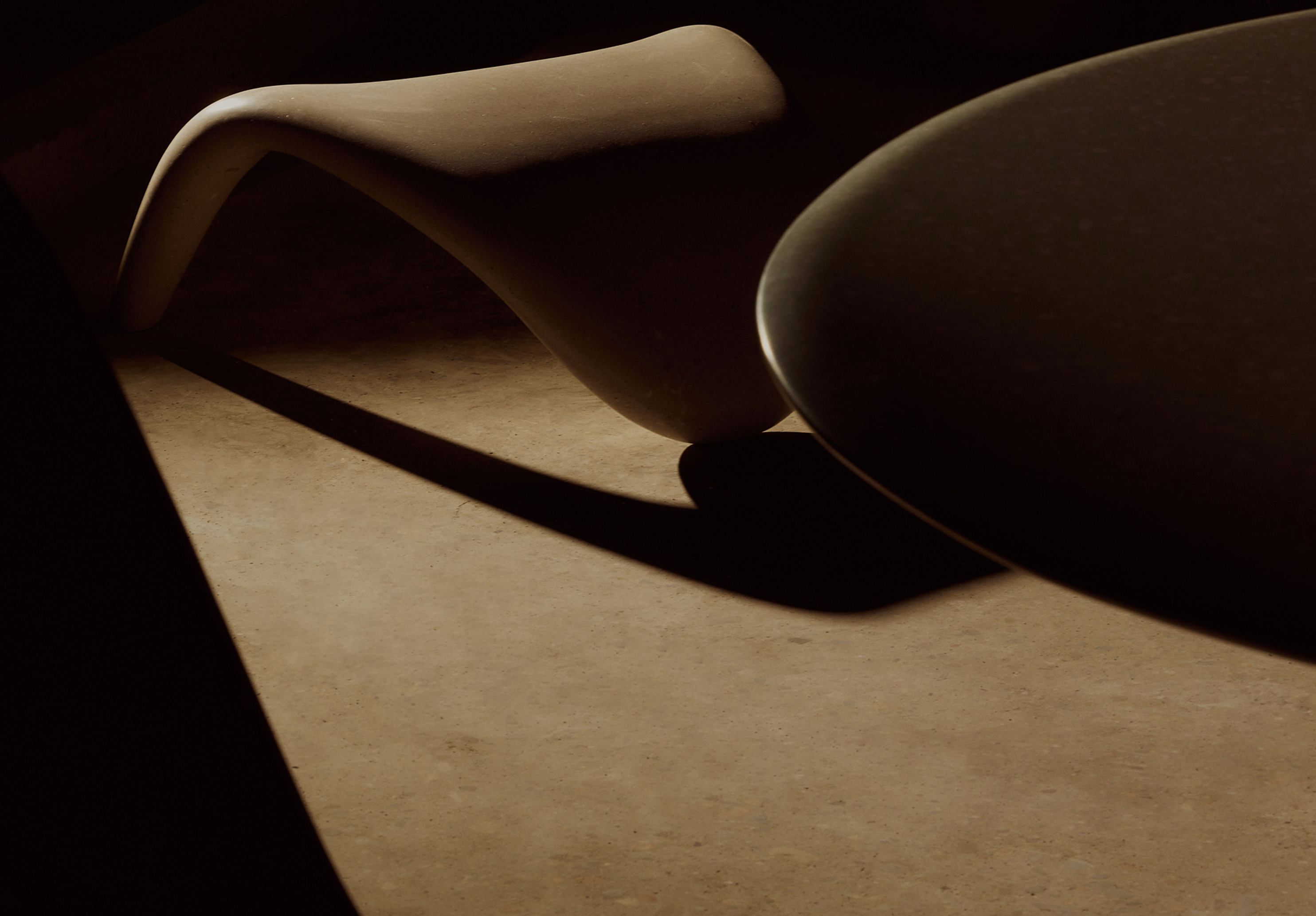 Sculptural interior object lit by warm directional light